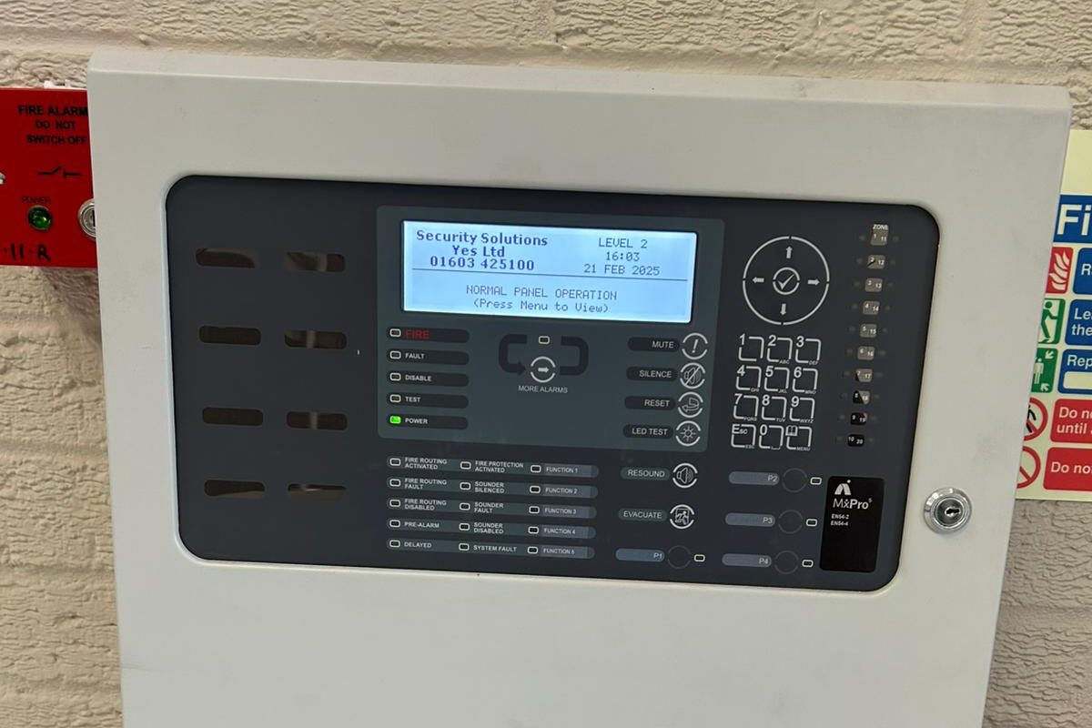 Addressable fire alarm control panel installed and maintained by Hawthorne, with the panel isolation switch alongside.